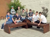 Youngsters pitch in to clean memorial seat