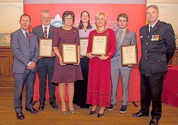 Rowers honoured  for rescuing teens