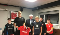 Wales star Ben returns with gift
