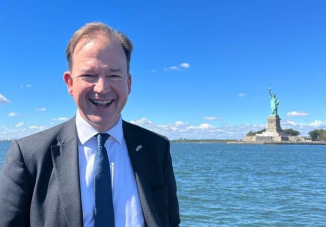 Jesse Norman MP, aboard the HMS Queen Elizabeth, in front of the Statue of Liberty.