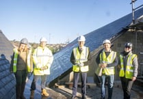 Harper checks out new Levelling Up-funded solar panels at the Wesley