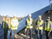 Harper checks out new Levelling Up-funded solar panels at the Wesley