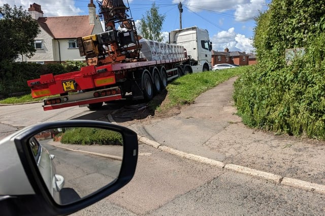 A HGV driving over a grass verge on Middleston Avenue