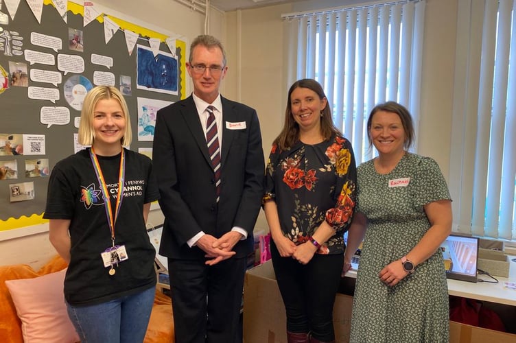 Monmouth MP David Davies with members of the county's Women's Aid team