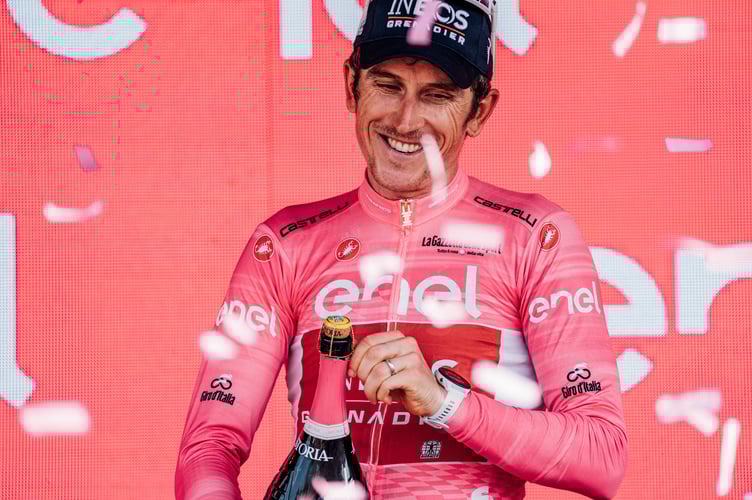 Giro leader Geraint Thomas opens a podium bottle of bubbly on his 37th birthday 