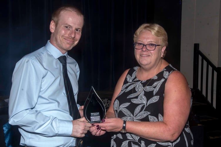 Tom Baxtor of Chepstow Tae Kwon-Do Club was named Sporting Hero. He received his award from sales executive Carole Richards.