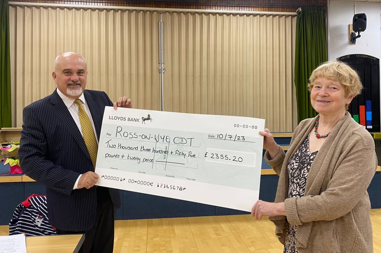 Former mayor Ed O'Driscoll handing a large cheque to - another - former mayor Jane Roberts