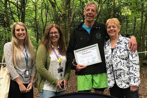 Colin Laver receives a certificate from Cllr Carole Allway-Martin (right) and representatives of theNHS in Gloucestershire
