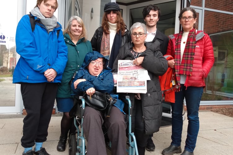 Owen B Lewis is pictured on the right (in the blue jacked) with campaigners outside County Hall in Usk