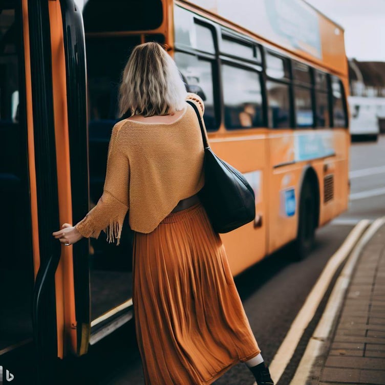 Woman getting on bus