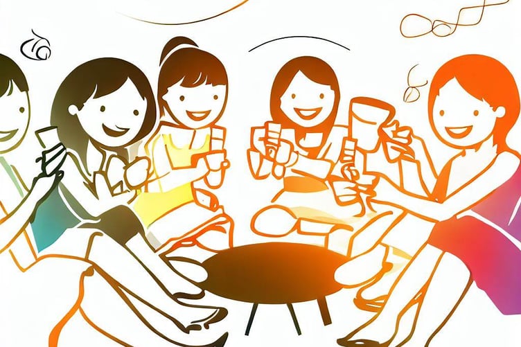 Several women sitting around drinking coffee