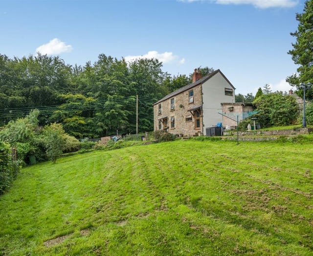 Character cottage for sale sits directly opposite woodland 