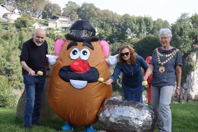 Potato and spoon race: Mr Potato Head was welcomed by Mayor of Chepstow Cllr Margaret Griffiths (right) and members of the Chepstow Spudfest organising committee, Cllrs Jim MacTaggert and Vanessa Badderley-Potter, at the Pebble sculpture at the start and finish of the Wales Coast Path, Chepstow.
