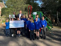 School 'so grateful' to village garage after playground donation