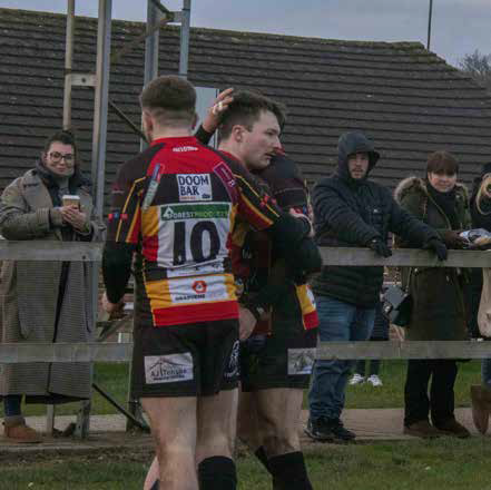 Will Baldwin is congratulated after scoring for Cinderford