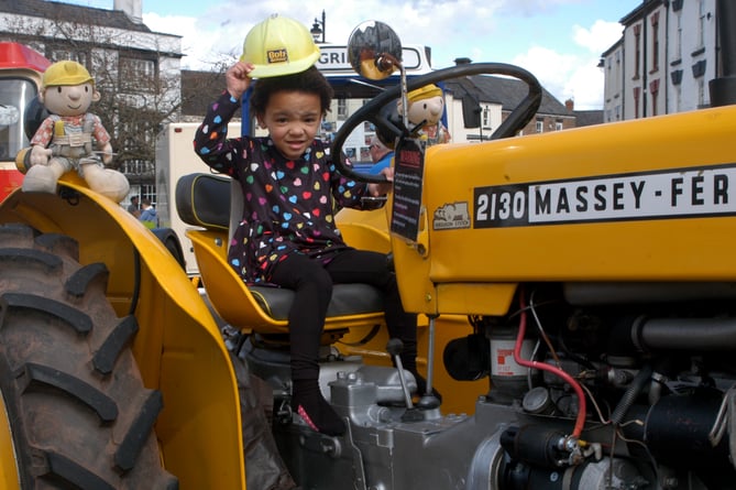 Willow Brain, aged four, from Soudley and Bob the Builder on board a yellow liveried Massey Ferguson 2130                    