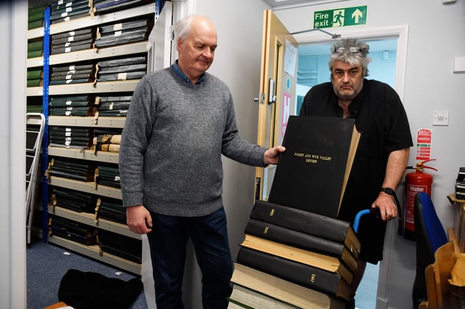 Archive volunteer John Byett and town councillor Mark Turner bring volumes of the Review into it new home.