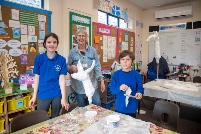 Artist Clare Viner with two of the sculpture makers.