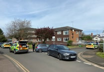 Man in hospital and woman arrested following car incident