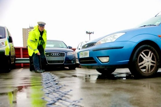 A policeman with a stinger device (file pic)