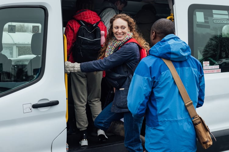 People boarding bus