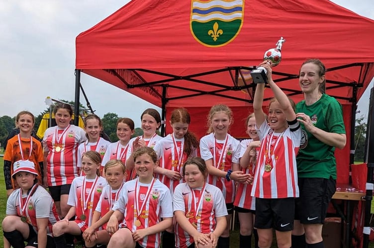 Kerys Harrop and the winning Ross Juniors U10 girls' team
