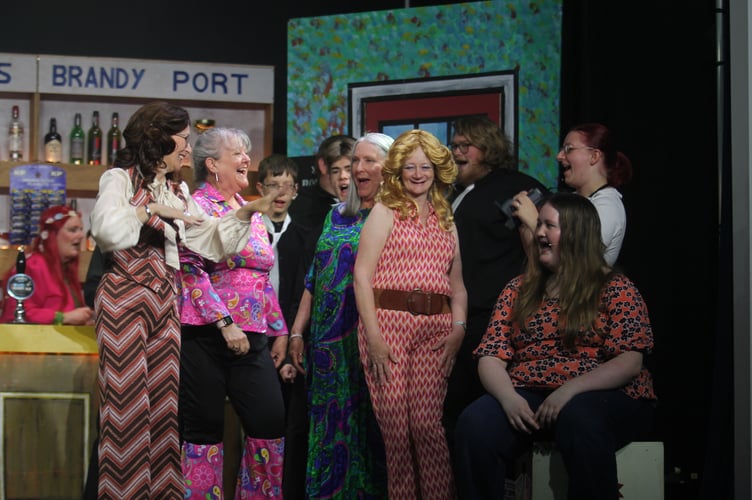 Jan (Jo Postle) is welcomed back after going to London.