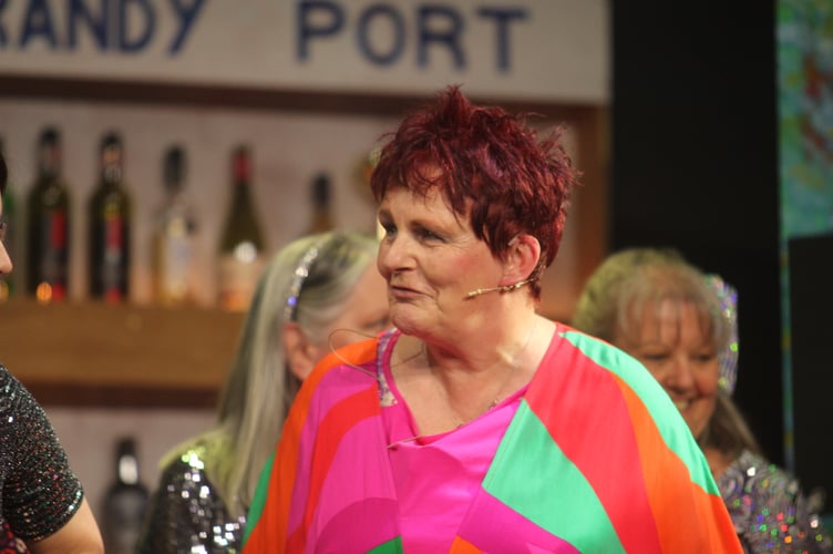 Beth Major as Delia, the bar owner