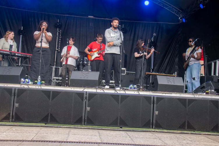 The GS Collective with their jazz-infused sound on the main stage.