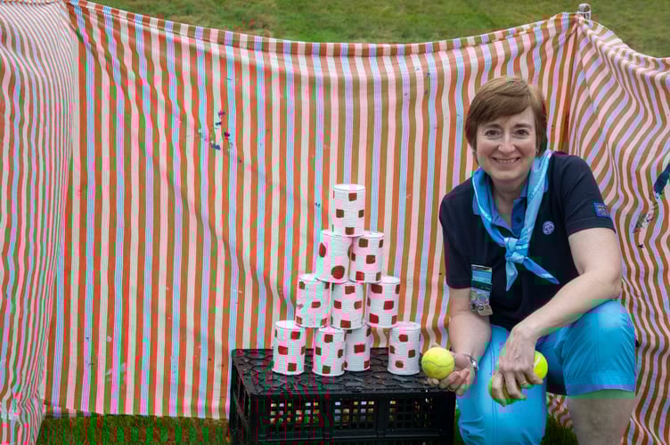 Frances Beavis of Gloucestershire Girl Guiding with a game at their stall.