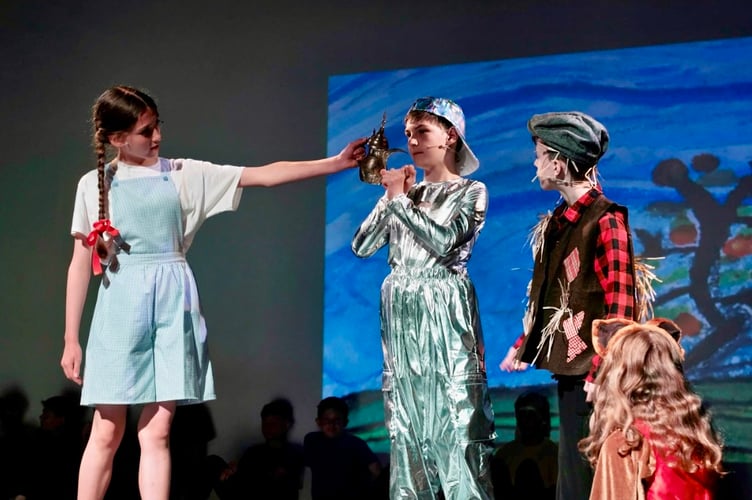 Dorothy oils the Tin Man in the Wizard of Oz