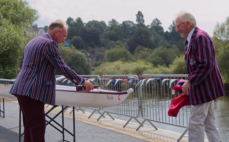 Torsten Pope, left, and Jeremy Picton-Turbervill bless the new boat 'Rosie' at the top of the rebuilt steps. Photo: Imogen Bell