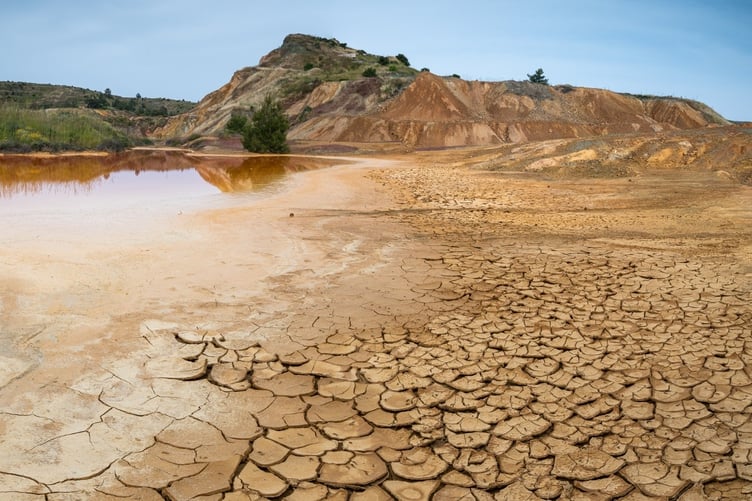 An example of desertification where fertile land becomes arid and unproductive due to unsustainable land management practices and climate change