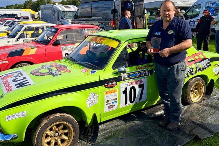 Andy Ruck with his Hills Ford Stages Spirit award next to next to the beautiful Escort of Jeremy Harris.