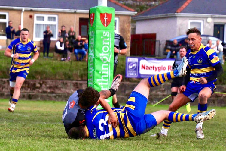Morgen Jeffs crashes over at the posts for Monmouths opening score