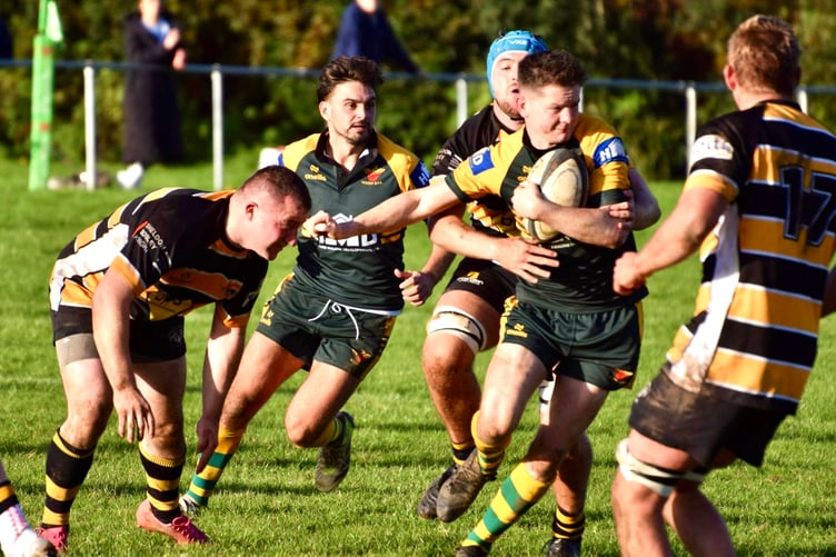 A Newent player tries to break through