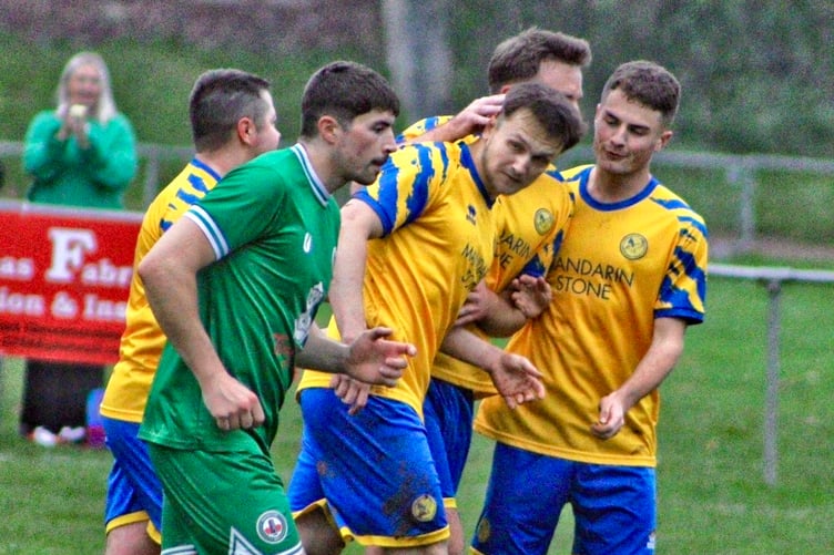 Hat-trick hero Josh Maksimovic is congratulated