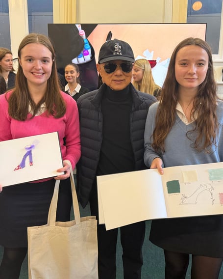 Jimmy Choo with two of the Monmouth School students at the workshop. Photo: Haberdashers Monmouth School