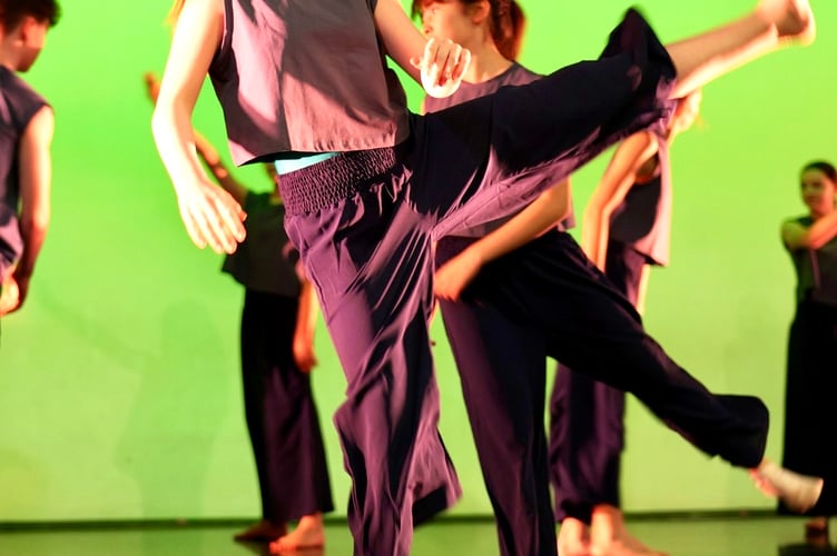 A dancer kicks for the stars in the Monmouth School showcase 