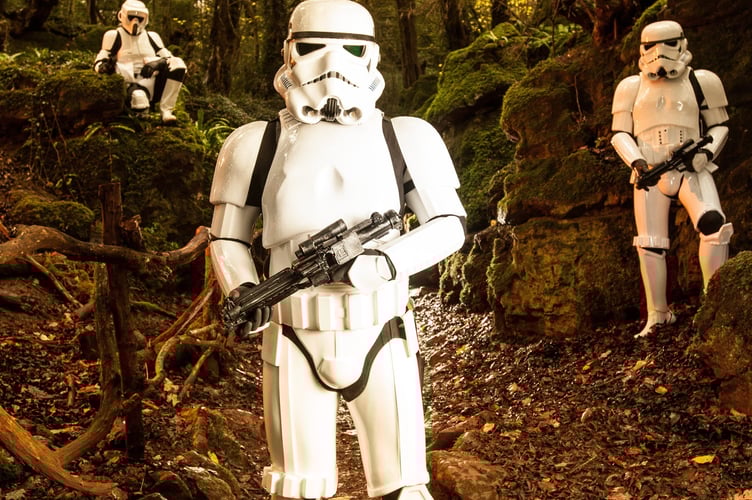 FILE PHOTO - Star Wars characters promote 'Star Wars: Episode VII The Force Awakens' in the Forest of Dean. Photo released December 12 2024. Researchers have begun studying the environmental impacts of Star Wars location shooting - over fears it disrupted a famous woodland.Puzzlewood, in the Forest of Dean, was an important filming location for Star Wars 'The Force Awakens' in 2014.If you were one of the many Star Wars fans who caught sight of the film crews descending on the Forest of Deanâs ancient Puzzlewood for iconic then an Open University research academic wants to hear from you.Dr Rebecca Harrison works in the OUâs Film and Media department and is conducting a study called the âEnvironmental Impact of Filmmaking (EIF)â using Star Wars, its film props and locations as the theme.
