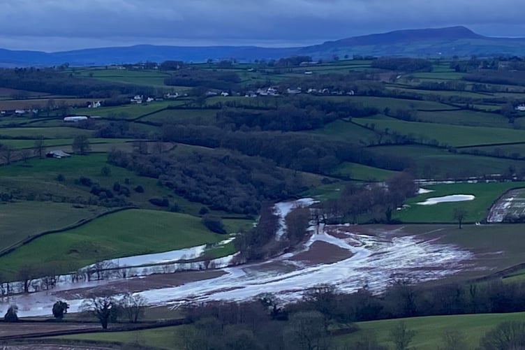 Flooded fields in the Monnow Valley looking towards the Skirrid