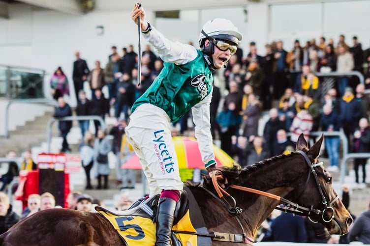 Charlie Deutsch salutes after victory at Cheltenham. Photo Cheltenham Racecourse