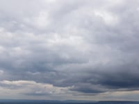Mild day with partly cloudy skies and patchy rain nearby tomorrow