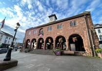 Woman pedestrian taken to hospital after town centre collision