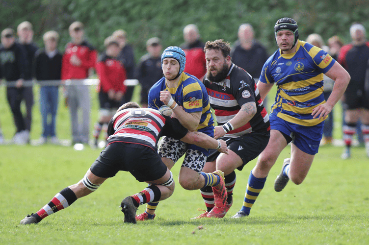 Ollie Parks powers into a tackle