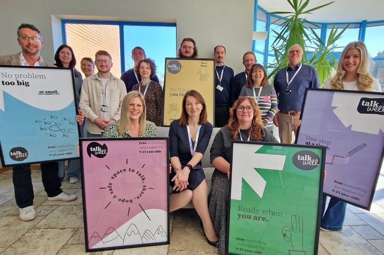 Chief executive Claire Power-Brown (centre) with the rest of the Talk Well team.