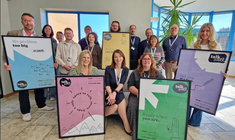 Chief executive Claire Power-Brown (centre) with the rest of the Talk Well team.