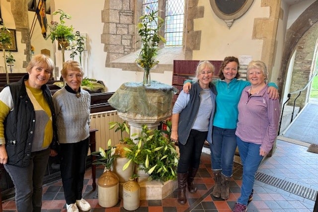 Vanessa Martin, Beryl Griffiths, Meryl Williams, Eleanor Cook and  Margaret Willis with a display of lilies.