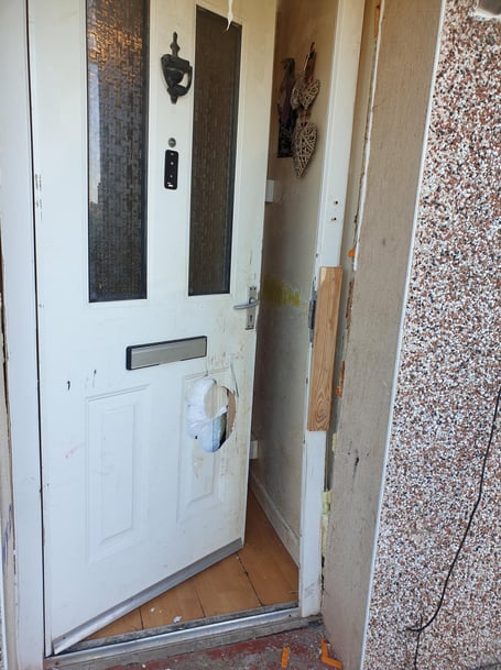 Door knocked in