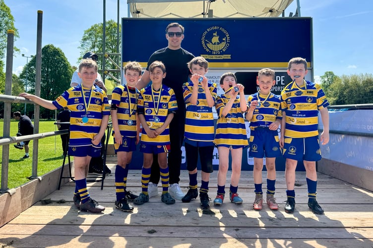 Monmouth's U9 Sharks were delighted to be presented with their medals by Wales star Taine Basham